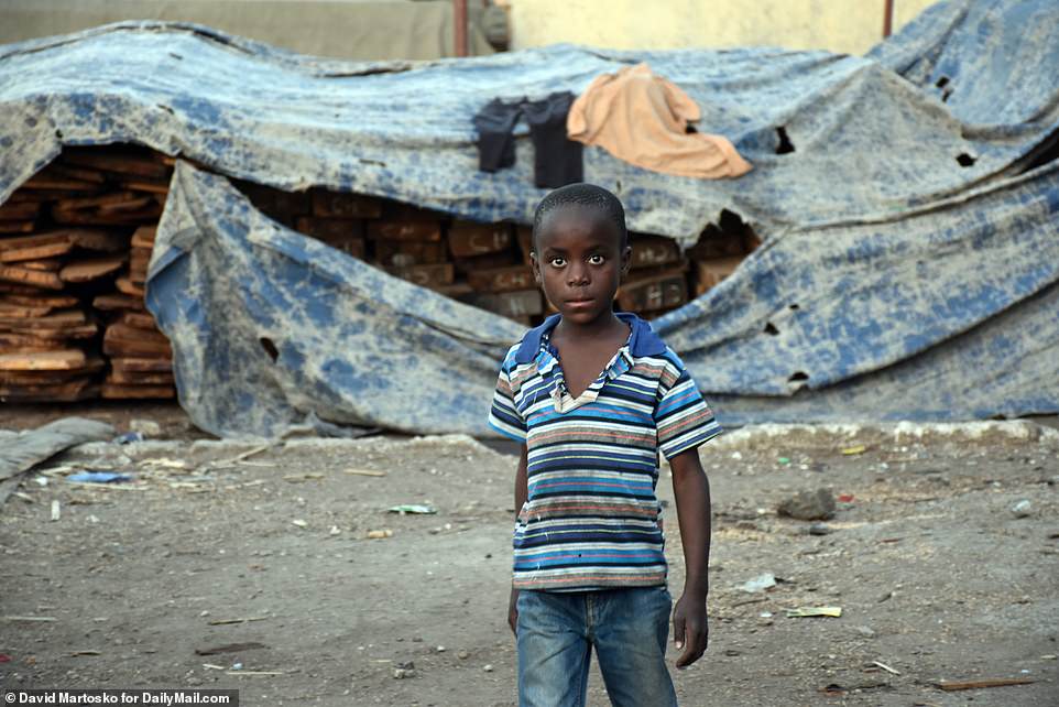 Land of a million orphans: Benjamin, a Zambian boy in the Buseko Market slum of the capital city Lusaka, doesn