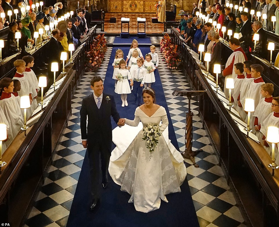 Princess Eugenie and Mr Brooksbank walks down the aisle of the Quire after they were married at St George