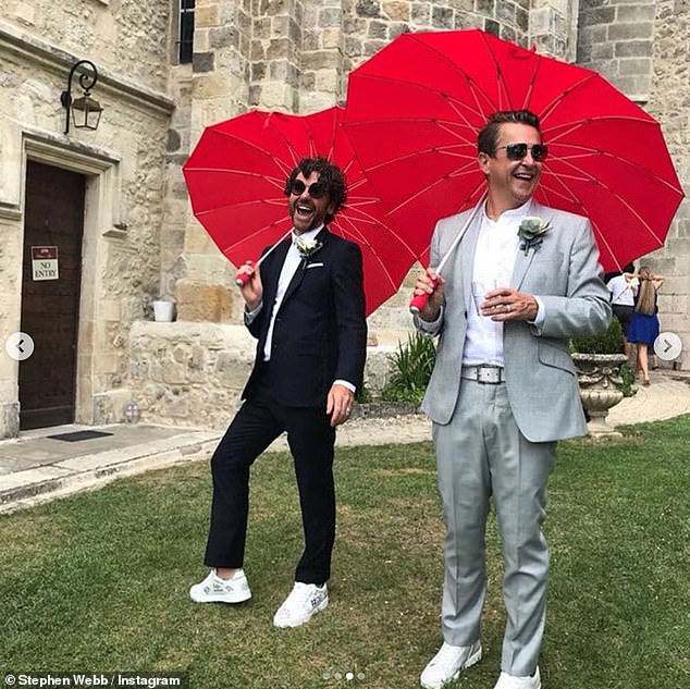 Romantic: The Gogglebox star, 48, shared a snap from their wedding album of the couple holding hands as they walked down the aisle after a romantic ceremony in a chateau
