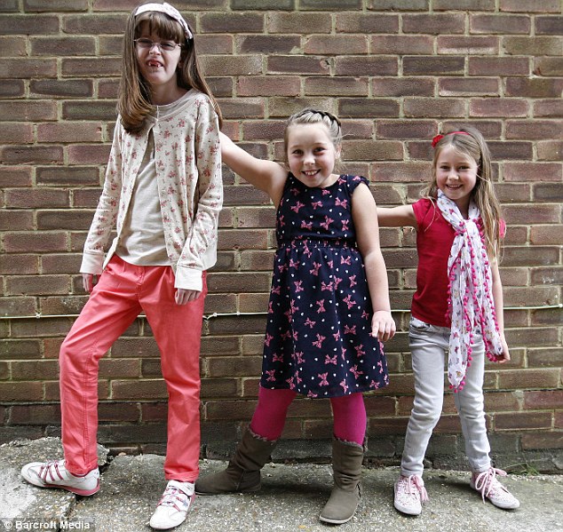 Over the top: Sophie offers some support to her friends Daisy and Keira