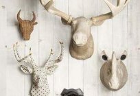 Deer head with their hands out of cardboard or plywood