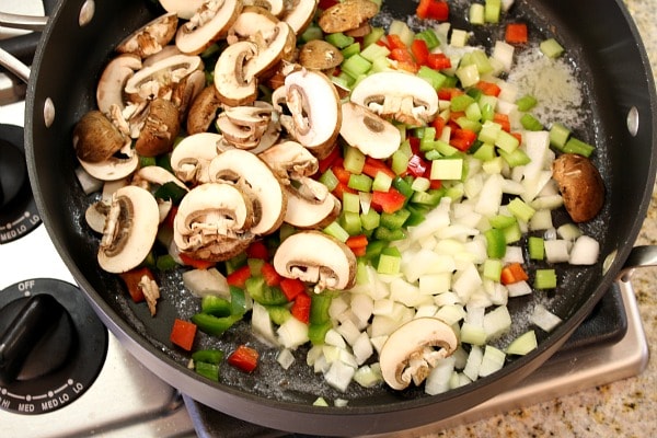 sauteing vegetables in a skillet to make chicken spaghetti casserole