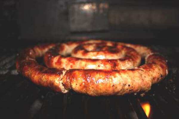 Coil of Sausage Cooking In a Smoker